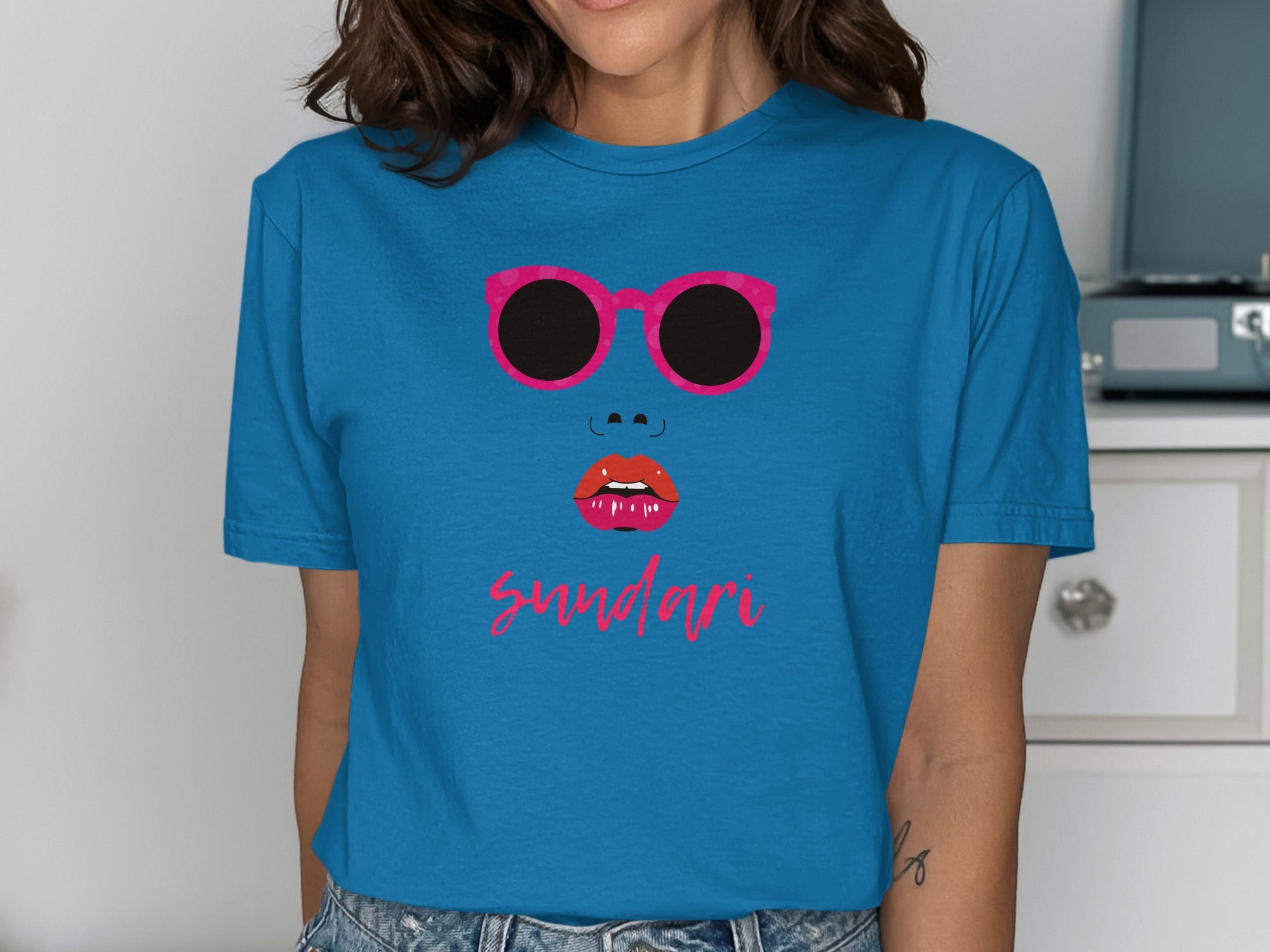 Blue T-Shirt Featuring Bold Sunglasses Graphic Design